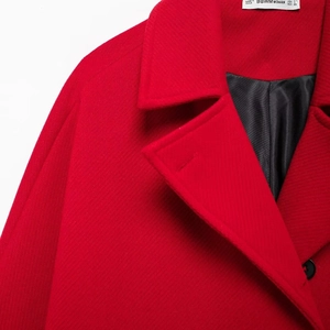 Women's warm red wool blend coat featuring stylish oversized lapels in a loose-fit design