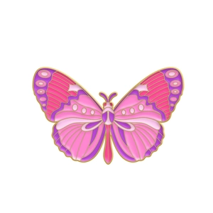 Macro detail of butterfly enamel pin showing pink and purple gradient with gold edges