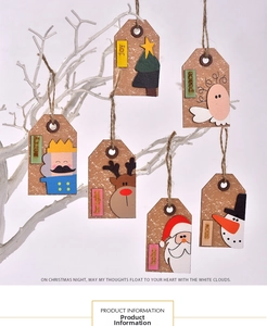 Close-up of wooden Christmas tree ornaments with Santa, deer and angel designs