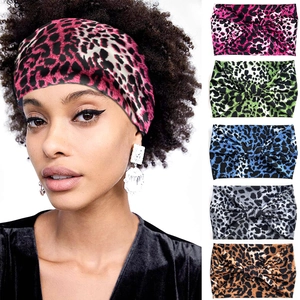 Detail of leopard print elastic headbands in pink green blue grey and brown colors