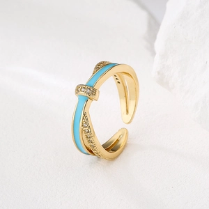 18K gold-plated adjustable ring with crisscross design and blue enamel accents
