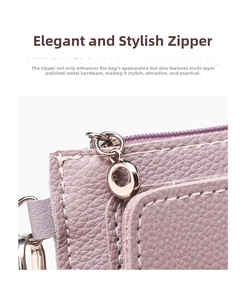 Close-up of lavender leather coin purse with polished metal zipper and white stitching
