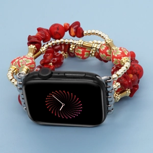 Detail of red stone beads and gold metal accents on Apple Watch braided strap