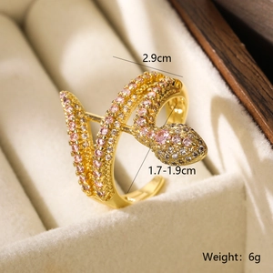 Macro shot of gold snake ring with pink stones showing dimensions 2.9cm and 1.7-1.9cm