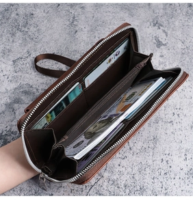 Detailed interior of a brown leather long wallet featuring multiple card slots and zipper pocket