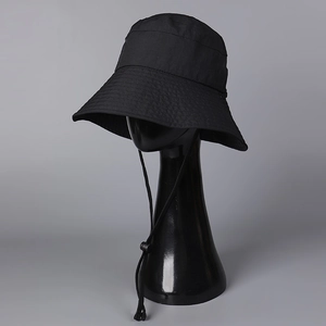 Detail of quick-dry sun hat showing breathable fabric texture and adjustable chin strap