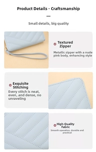 Detail view of light blue quilted leather texture with gold zipper and stitching
