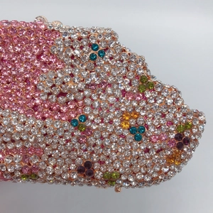 Macro detail of colorful crystals and rhinestones on the popsicle evening clutch bag