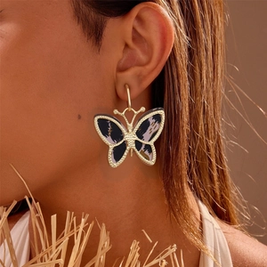 Chic acetate butterfly hoop earrings with marble texture on gold metal frame