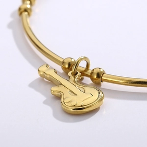 Polished gold titanium guitar charm bracelet for women with minimalist violin-style design