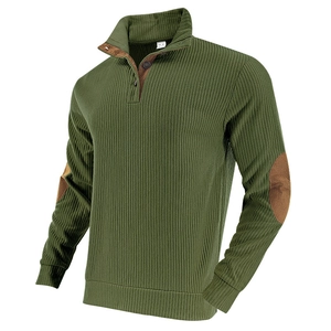Detail of olive green ribbed sweatshirt with brown elbow patches and button neckline