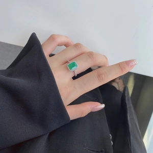 Macro shot of a luxury S925 silver ring featuring a large rectangular green zircon stone