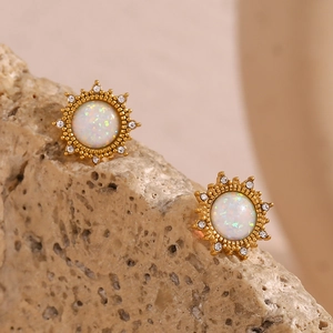 Detailed close-up of opal sunflower earrings with gold setting and white zircon accents