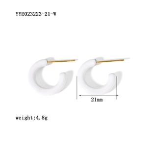 Detail view of 21mm white C-shaped enamel hoop earrings with size and weight metrics