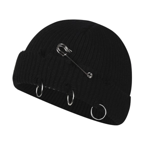 Punk style black knit beanie with metallic rings and safety pin for a street look