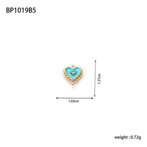 Detail of blue heart pendant with gold rim and faux diamond, size 1.03x1.27cm