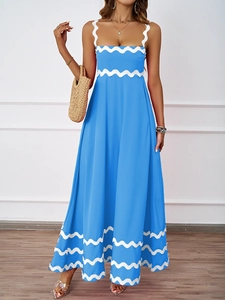 Detailed close-up of blue summer maxi dress with white wavy trim and elegant square neckline