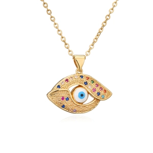 Bohemian gold plated devil eye pendant necklace with colorful zircon stones on white background