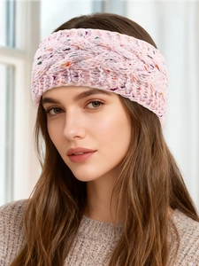 Close-up of pink cable knit headband with colorful tweed specks on female model