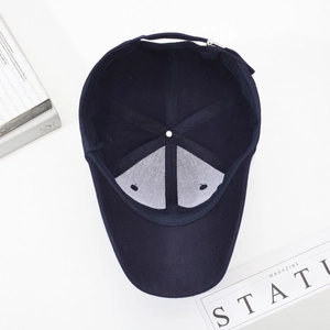Navy blue cotton baseball cap shown from bottom angle with adjustable metal buckle