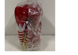 Christmas elf doll with red and white striped legs in transparent packaging for decor
