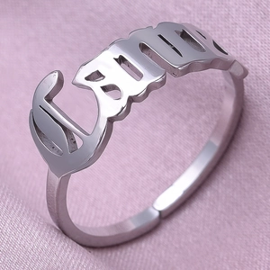 Detailed macro view of an adjustable stainless steel ring with Gothic Bella name design