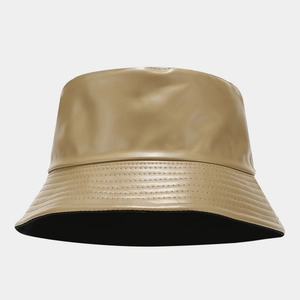 Detailed view of the parallel stitching on a khaki faux leather reversible bucket hat