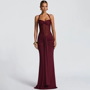 Detail view of burgundy halter neck maxi dress with elegant pleats and ruched fabric texture