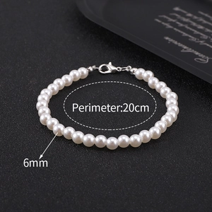 Detailed view of single layer 6mm white pearl bracelet with 20cm perimeter markings
