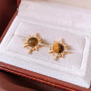 18K gold plated sunburst stud earrings with round tiger eye stone in a jewelry box