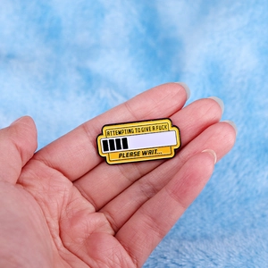 Funny enamel pin badge showing a loading bar and a humorous quote on a blue background