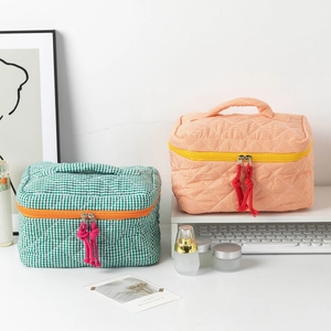 Quilted checkered portable makeup bags with orange zipper and top handle in two colors
