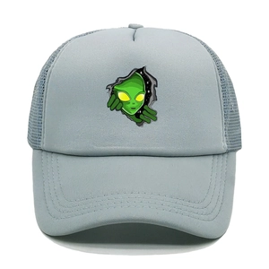 Detail of alien graphic print on grey mesh trucker hat with breathable blue netting