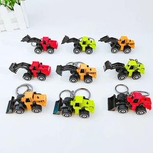 Nine-piece mini alloy construction vehicle keychains in vibrant yellow, red, and orange