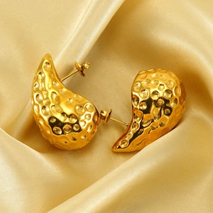 Chic 18K gold plated teardrop earrings with hammered texture on elegant silk background