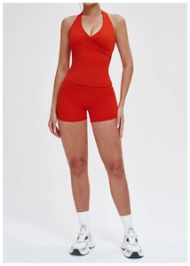 Front view of a red yoga set featuring a V-neck halter top and high-waist sports shorts