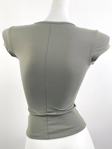 Detailed back view of grey-green slim fit sports T-shirt with vertical seam on mannequin