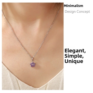 Close-up of elegant plum blossom necklace with purple zircon inlay on a female model