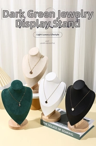 Detail of wooden base jewelry busts in velvet and leather for necklace display