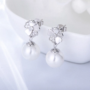 Elegant S925 silver flower earrings with sparkling zircons and white pearls set on ceramic