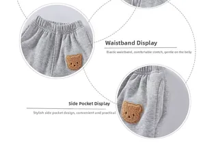 Dettaglio dei jogger grigi per bambini con elastico in vita e ricamo di orsetto 3D