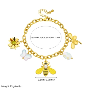 Golden stainless steel charm bracelet with bee, butterfly, and flower pendants on white background