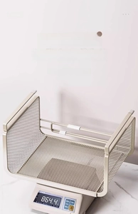 Detailed view of heavy-duty beige metal mesh basket weighing 864.4g on digital scale