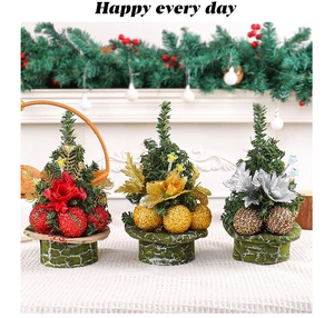 Detailed close-up of mini Christmas trees with red, gold, and silver ball ornaments