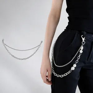 Detail view of triple-layered silver metal pants chain with beads and lobster clasps