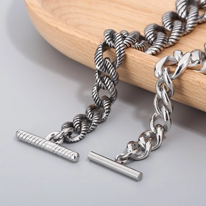 Detailed macro view of vintage stainless steel Cuban link bracelet with OT toggle clasp