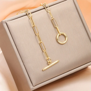 Elegant gold titanium steel paperclip chain necklace with OT toggle clasp on satin