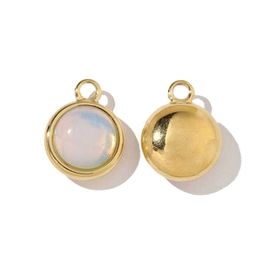 Detailed view of gold stainless steel round pendant with white opal inlay and smooth back