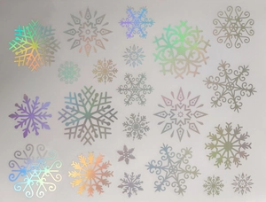 Detailed view of colorful holographic snowflake window stickers with rainbow luster effects