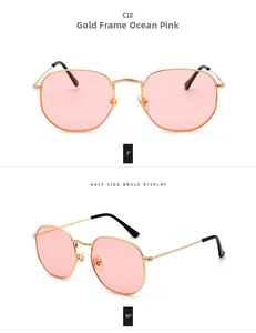 Detalle de gafas de sol irregulares de metal dorado con lentes de color rosa océano
